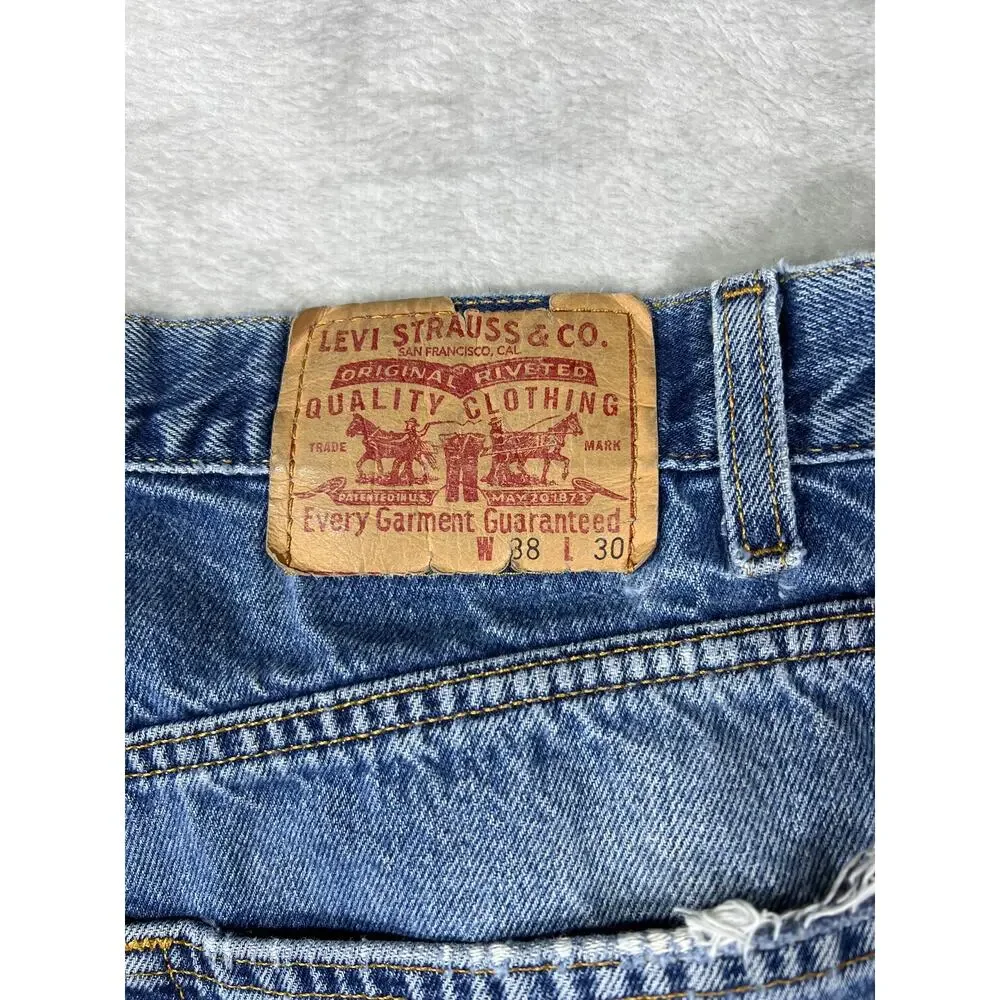 Vintage Levi's 550 Distressed Jeans 38x30 Made in USA Light Wash